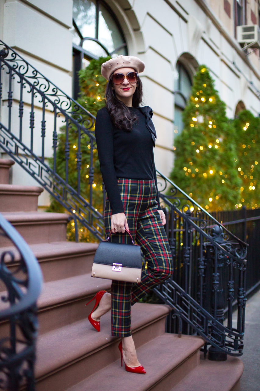 Alice olivia bow sweater, black bow shoulder sweater, ted baker bow sweater, jcrew plaid pants, jcrew black watch plaid, jcrew red plaid, jcrew black plaid, christian louboutin so kate in rouge de mars, louboutin red heel, henri bendel tri color purse, henri bendel tri color waldorf purse, asos pearl hat, asos pear beret, washington square hotel