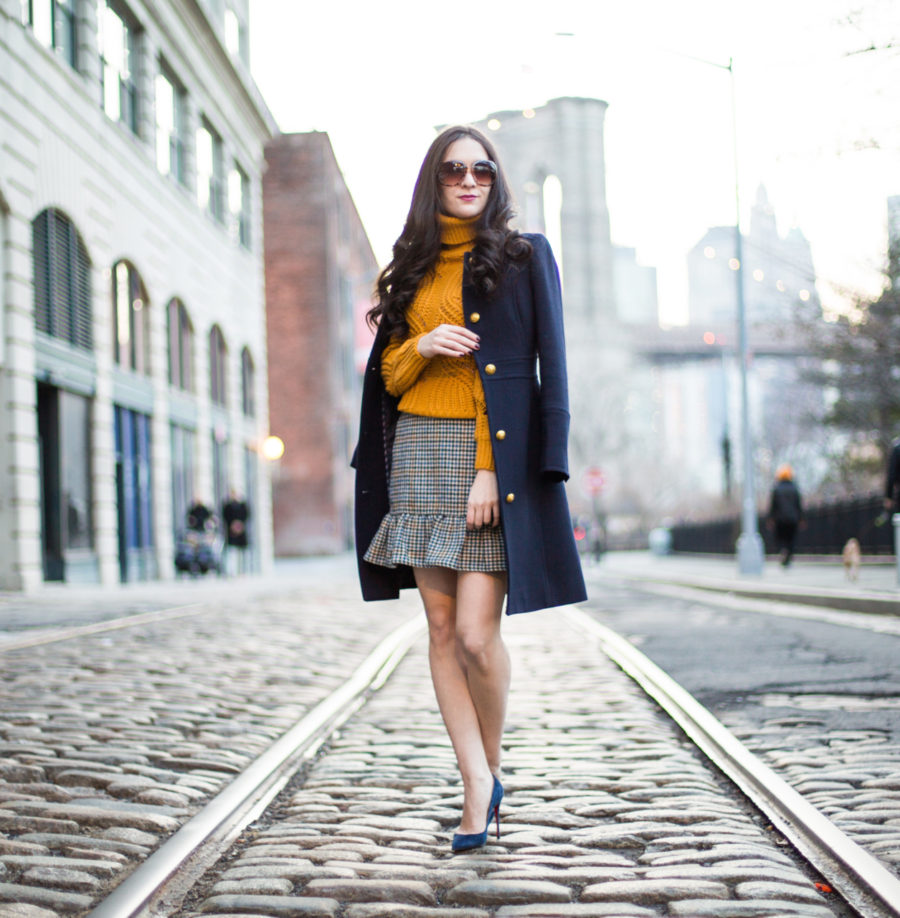 H&M knit turtleneck sweater in mustard yellow, j.crew houndstooth ruffle mini skirt, christian louboutin pigalle follies 100 mm in navy suede, j.crew ladyday coat in navy wool, dumbo, mustard knit sweater