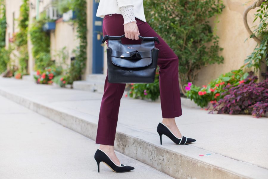 white house black market trophy jacket in white, whbm dotted victorian blouse, whbm comfort stretch slim ankle in burgundy, whbm black and white pumps, foley + corinna carlie satchel in black