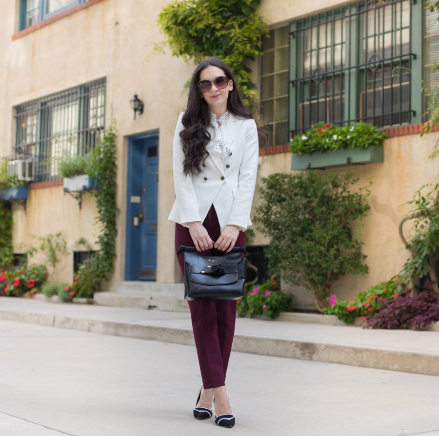white house black market trophy jacket in white, whbm dotted victorian blouse, whbm comfort stretch slim ankle in burgundy, whbm black and white pumps, foley + corinna carlie satchel in black
